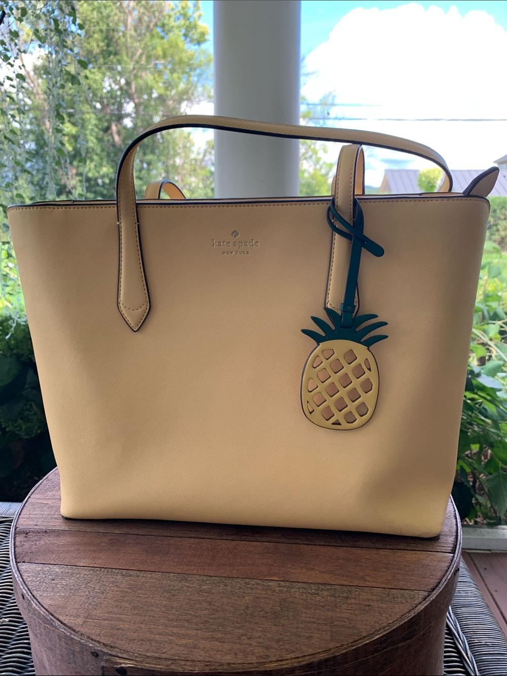 kate spade yellow leather tote with pineapple charm